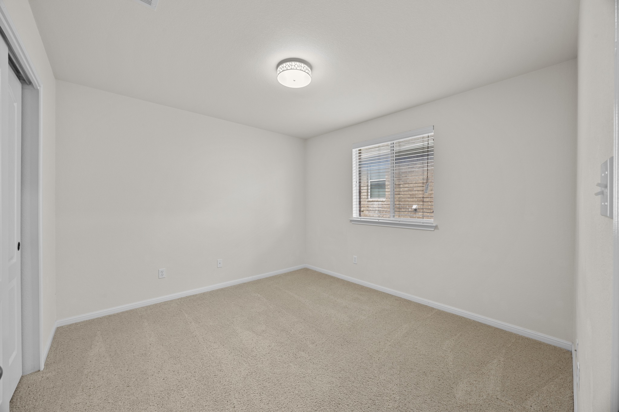 1317 Rimstone Drive Cedar Park, TX 78613 - Photo 7 of 32 Unfurnished bedroom featuring a closet and light colored carpet