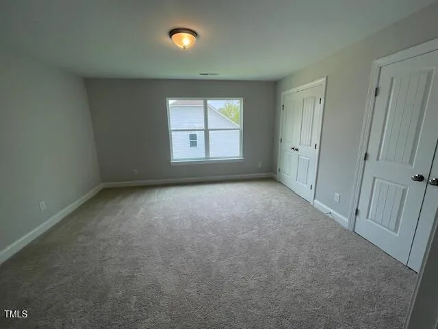 a white toilet sitting next to a bath tub