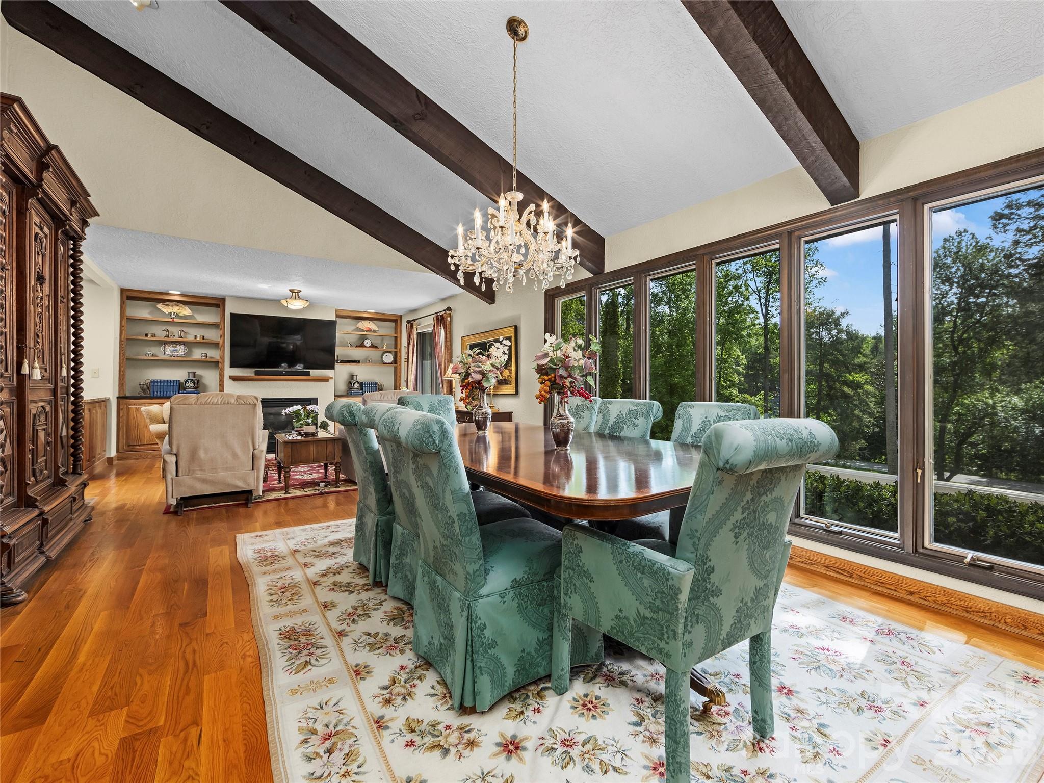 69 Forest Road Asheville, NC 28803 - Photo 13 of 48 a view of a dining room with furniture window and wooden floor