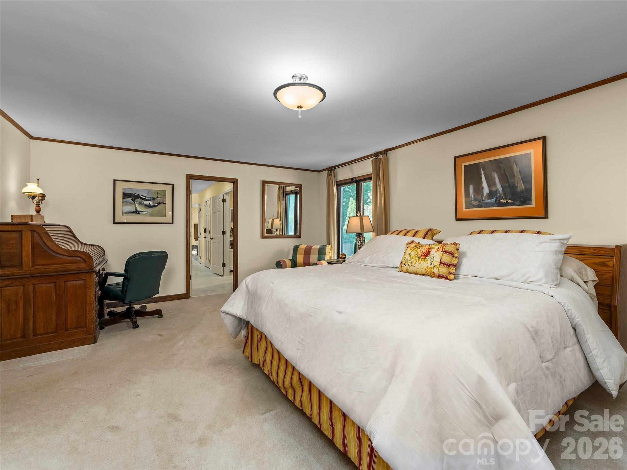 69 Forest Road Asheville, NC 28803 - Photo 18 of 48 a bed room with a bed and a chair