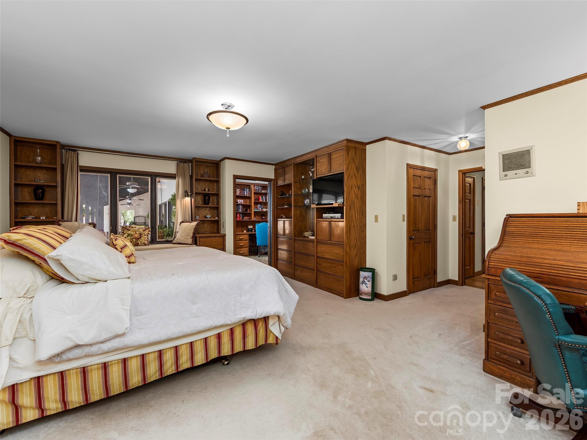 69 Forest Road Asheville, NC 28803 - Photo 19 of 48 a bed room with a bed and a chair