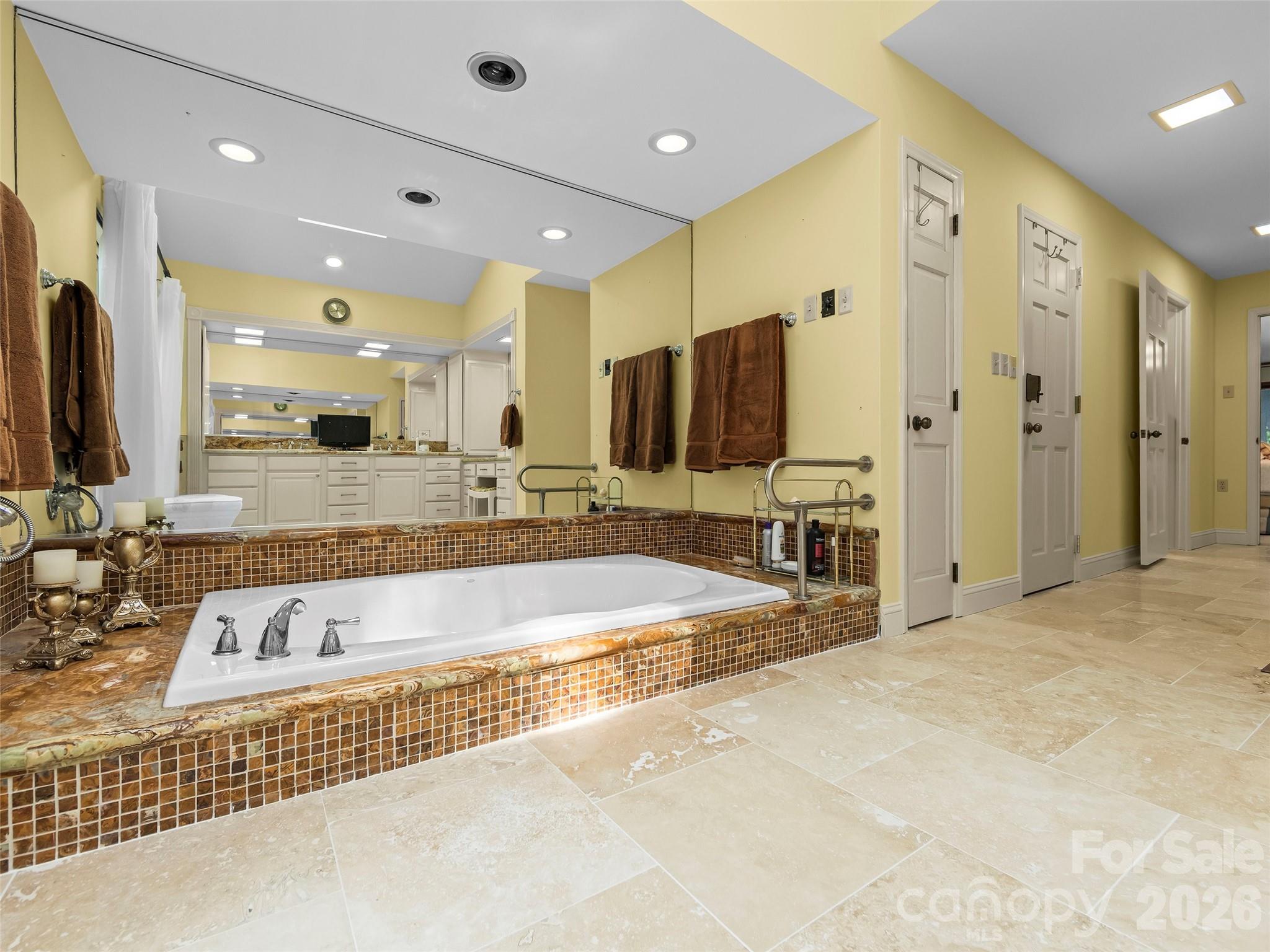 69 Forest Road Asheville, NC 28803 - Photo 20 of 48 a large bathroom with a large tub and sink
