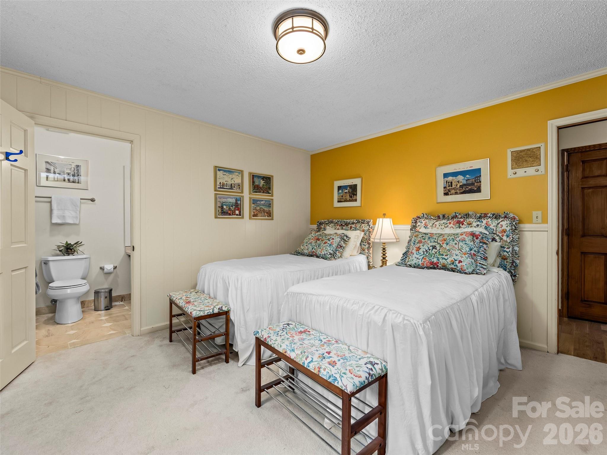 69 Forest Road Asheville, NC 28803 - Photo 22 of 48 a bed room with a bed and a chair