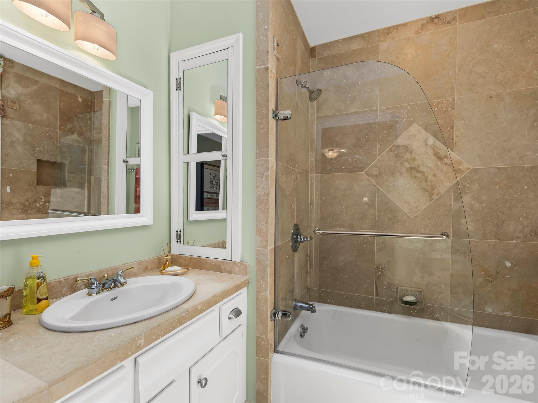 69 Forest Road Asheville, NC 28803 - Photo 26 of 48 a bathroom with a sink and tub