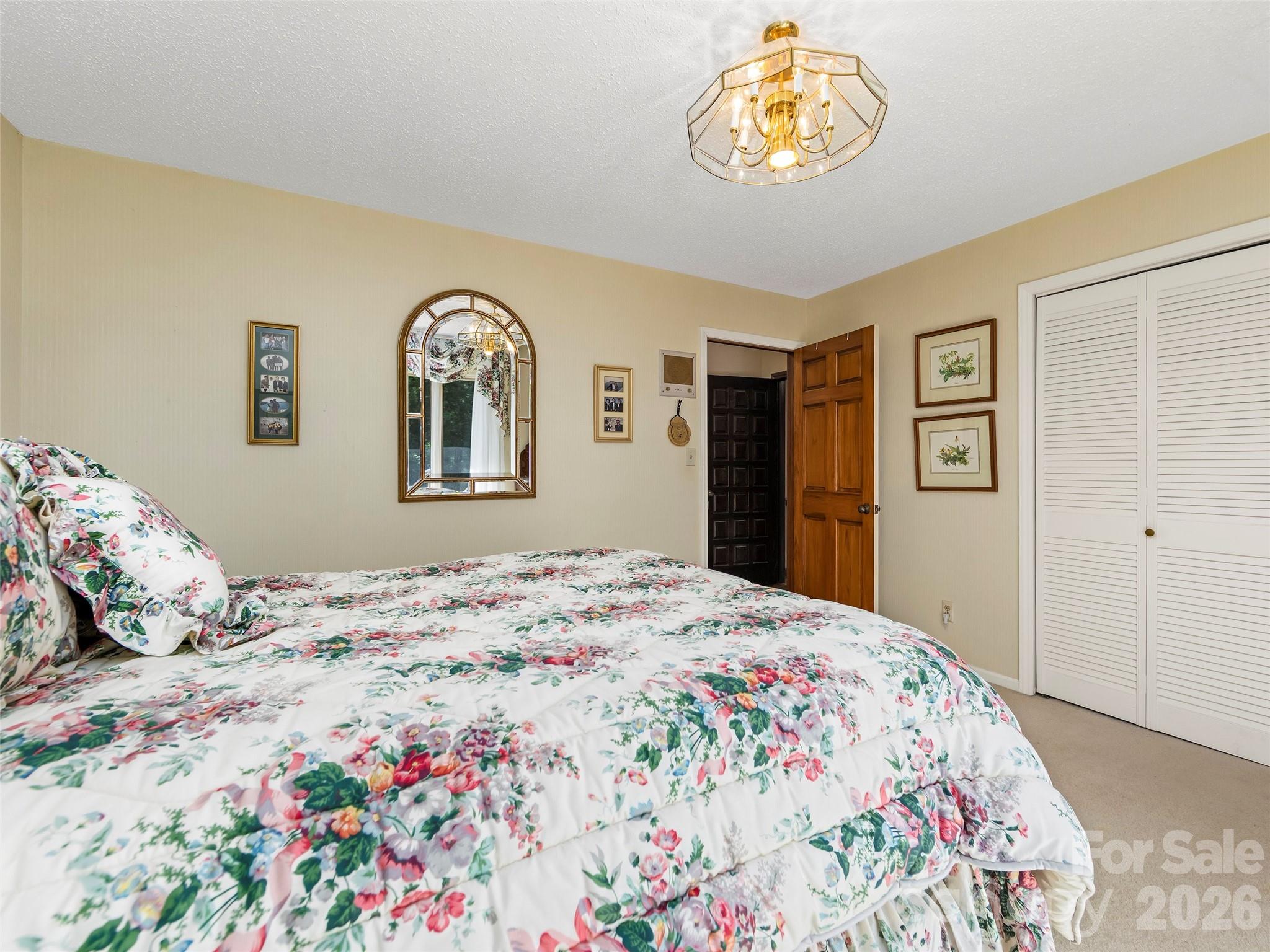 69 Forest Road Asheville, NC 28803 - Photo 28 of 48 a bedroom with a bed and a window