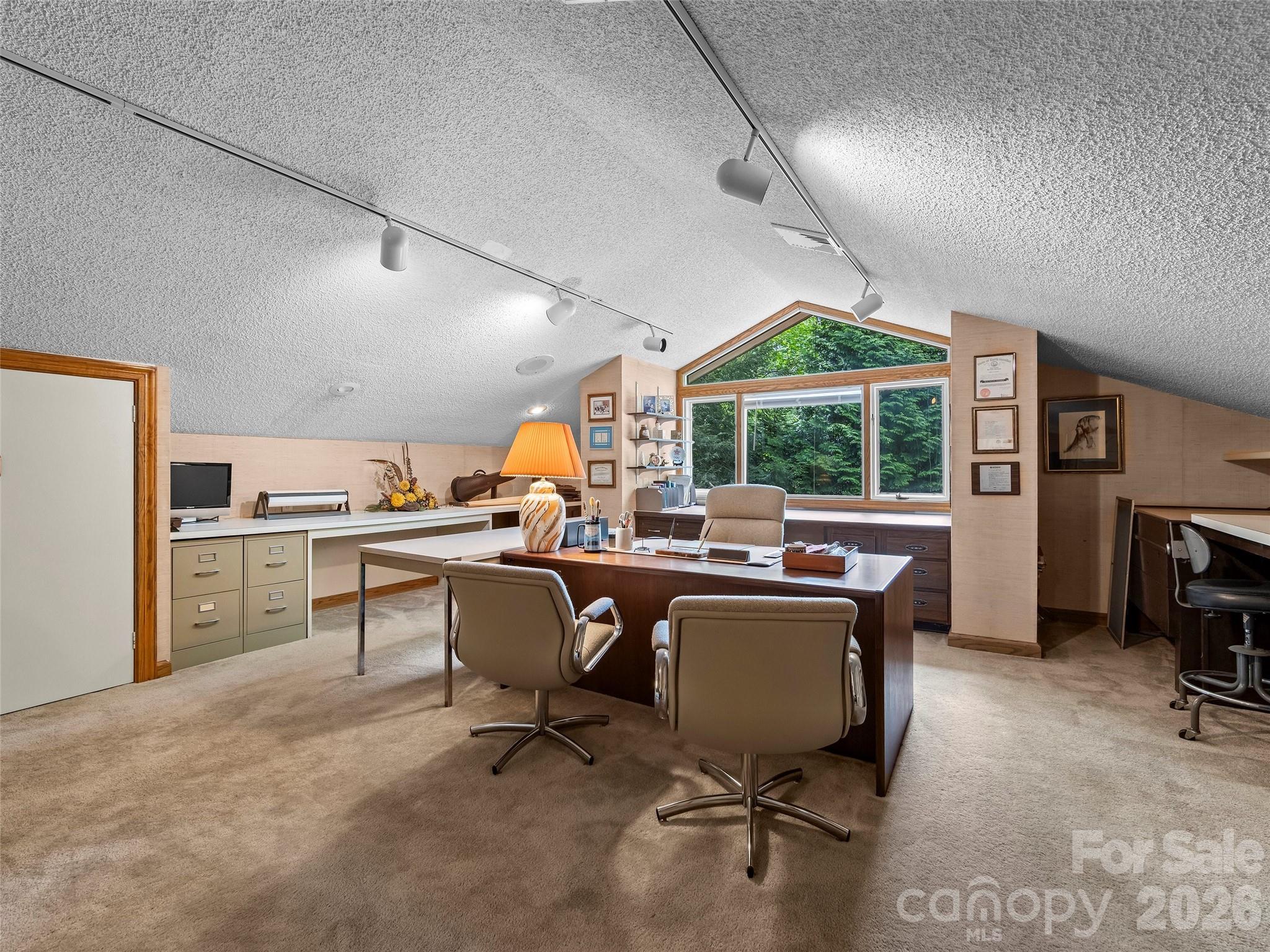 69 Forest Road Asheville, NC 28803 - Photo 29 of 48 a view of a workspace with furniture and a window