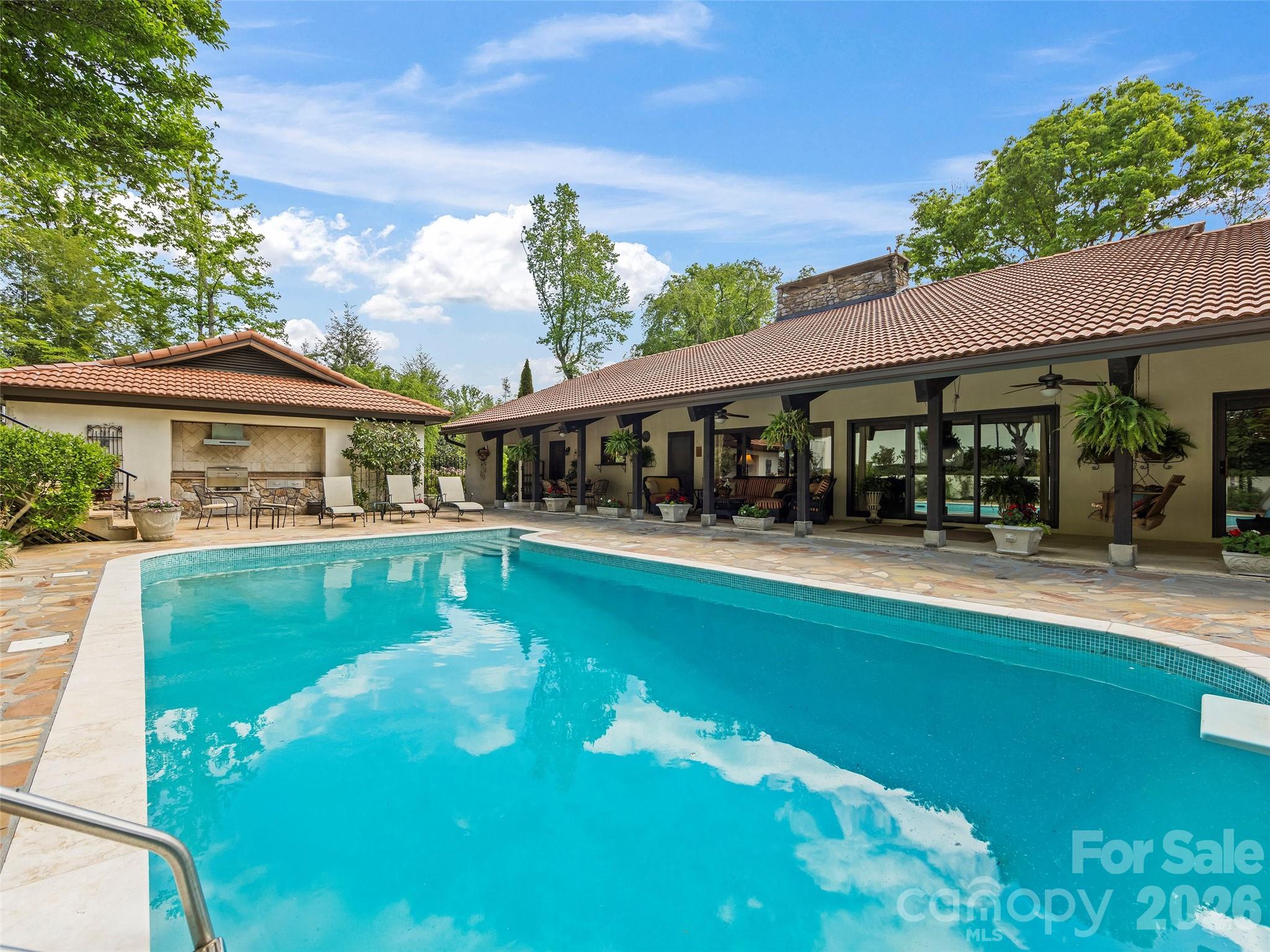 69 Forest Road Asheville, NC 28803 - Photo 39 of 48 a view of house with swimming pool and outdoor seating