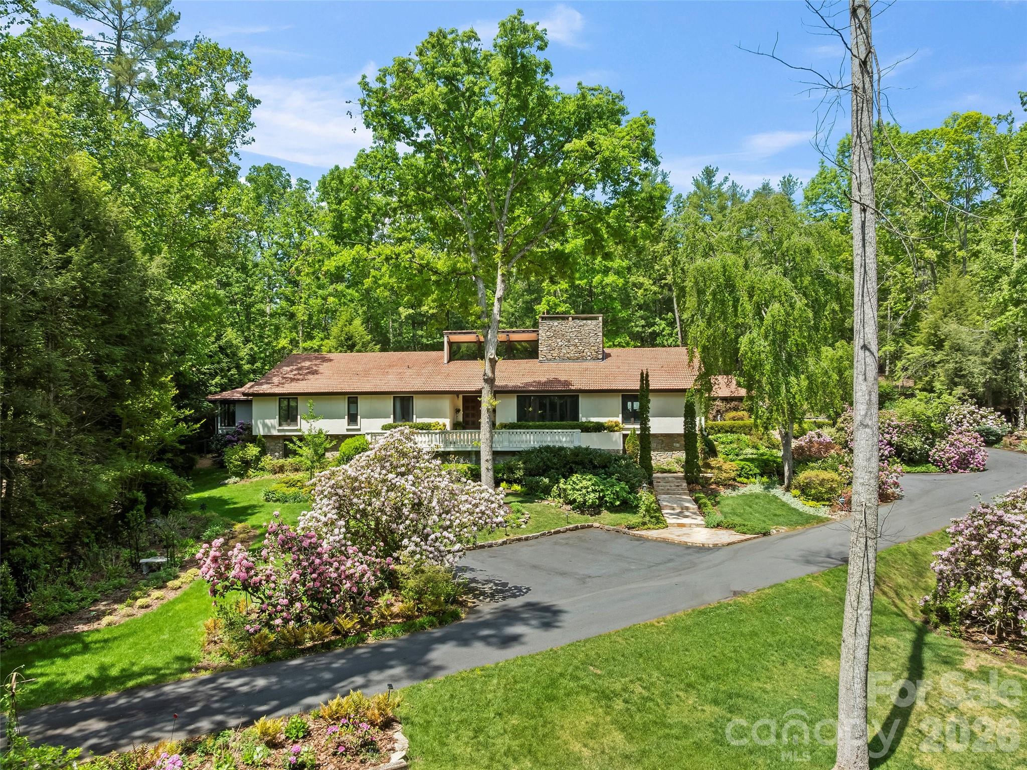 69 Forest Road Asheville, NC 28803 - Photo 45 of 48 front view of a house with a yard
