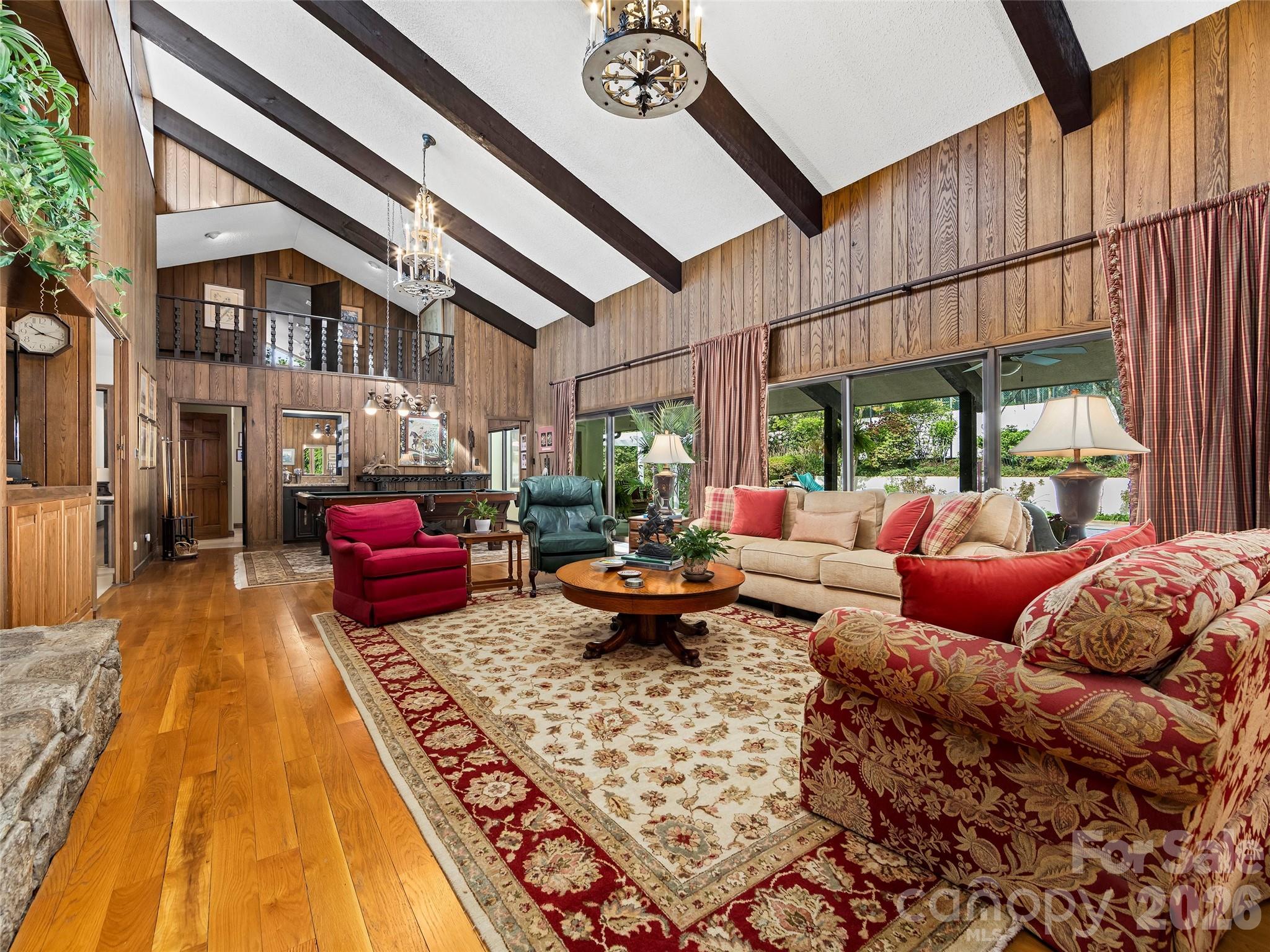 69 Forest Road Asheville, NC 28803 - Photo 6 of 48 a living room with furniture a rug and a floor to ceiling window