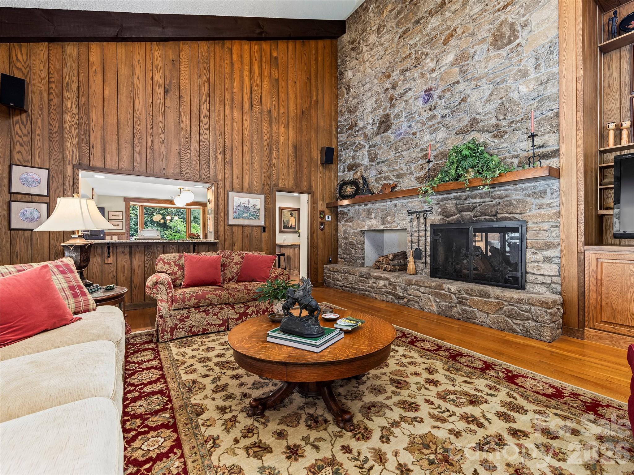 69 Forest Road Asheville, NC 28803 - Photo 8 of 48 a living room with furniture a rug and a fireplace