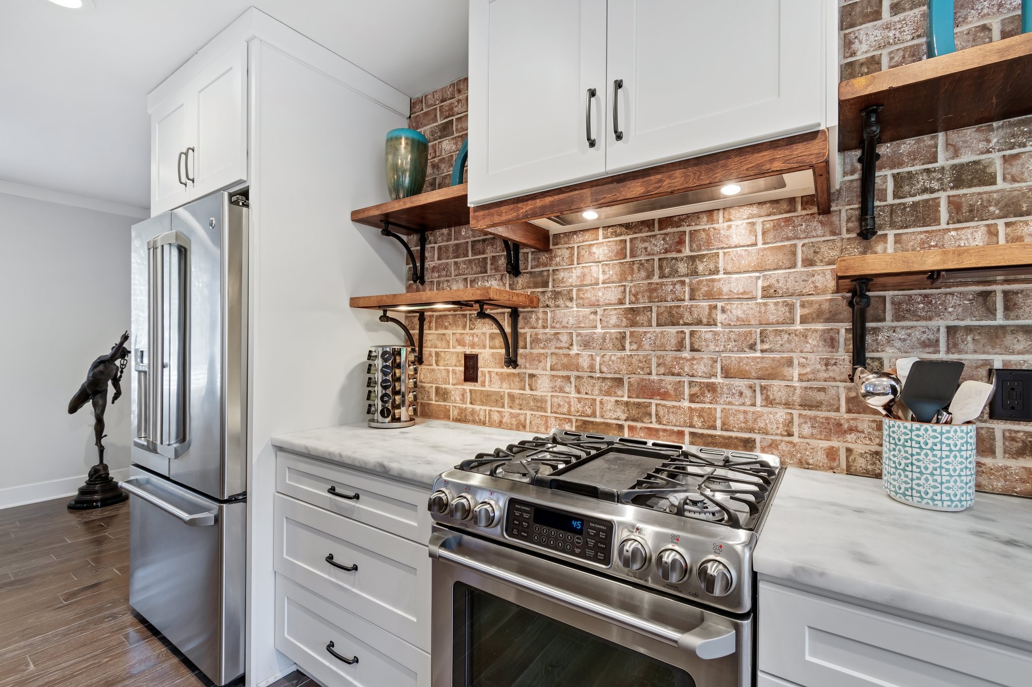 183 Lancaster Drive Franklin, TN 37064 - Photo 12 of 39 a stove top oven sitting inside of a kitchen
