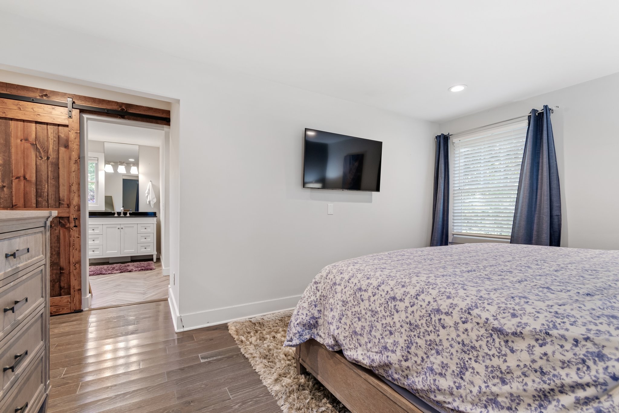 183 Lancaster Drive Franklin, TN 37064 - Photo 19 of 39 a bedroom with a bed and a flat screen tv