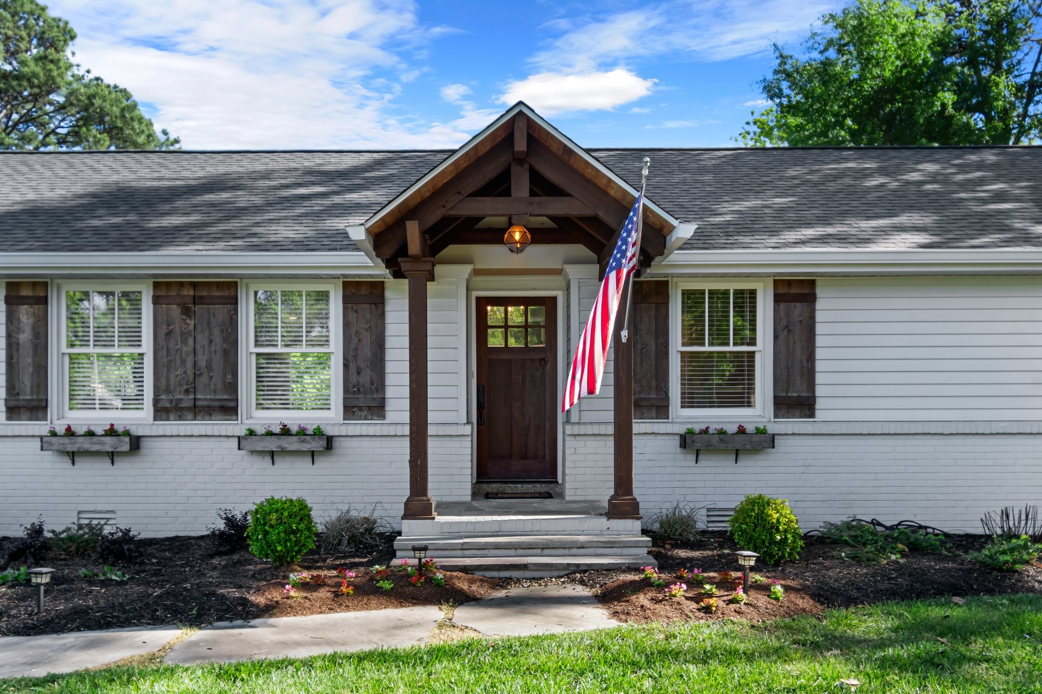 183 Lancaster Drive Franklin, TN 37064 - Photo 3 of 39 a front view of a house with garden
