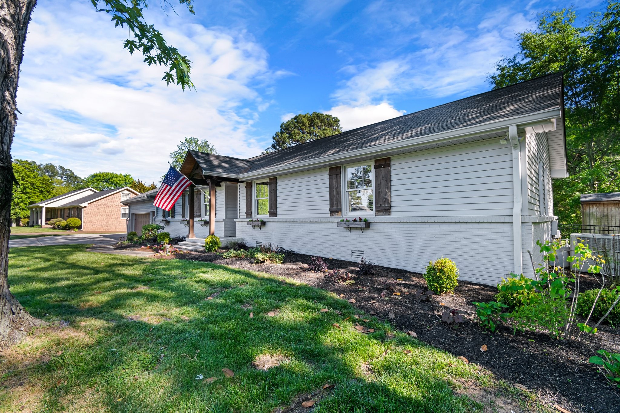 183 Lancaster Drive Franklin, TN 37064 - Photo 37 of 39 a front view of house with a garden