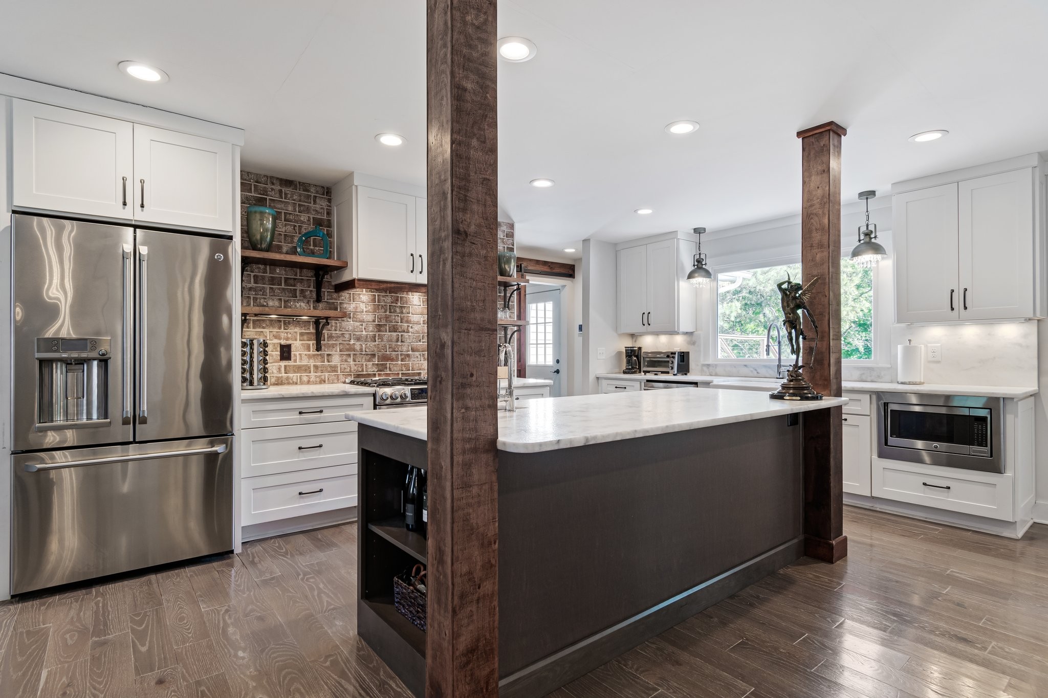 183 Lancaster Drive Franklin, TN 37064 - Photo 10 of 39 a kitchen with stainless steel appliances kitchen island granite countertop a refrigerator and a stove top oven