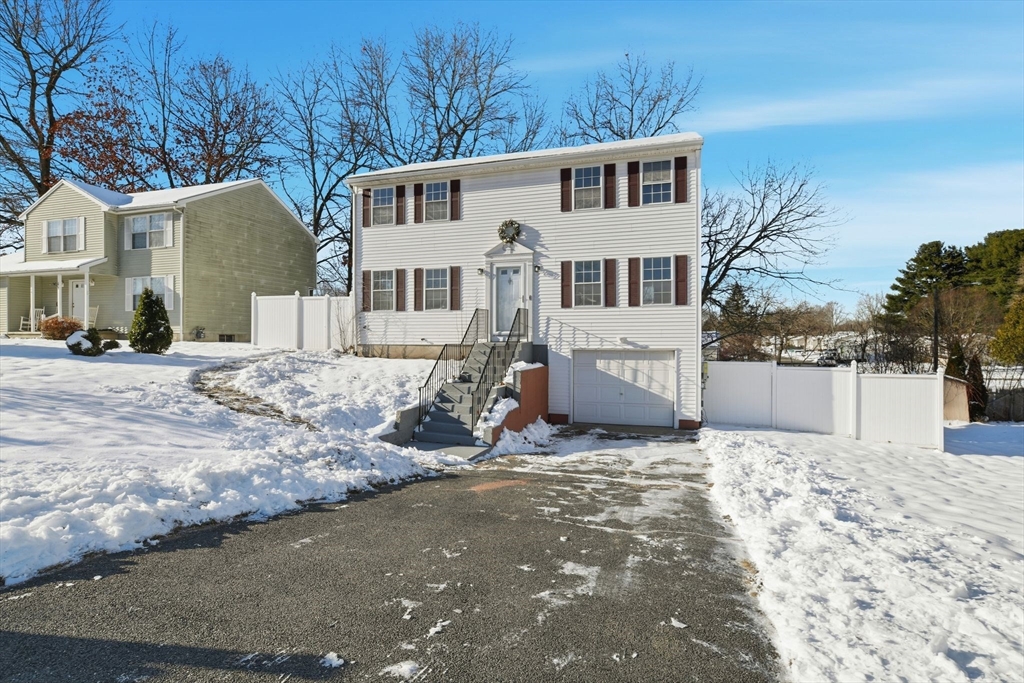 22 Pheasant Drive Springfield, MA 01119 - Photo 1 of 40 a view of a house with a snow in the background