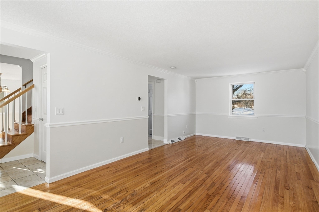 22 Pheasant Drive Springfield, MA 01119 - Photo 12 of 40 a view of empty room with wooden floor