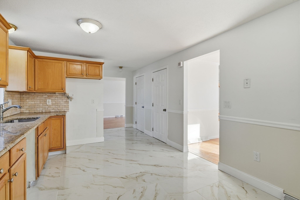 22 Pheasant Drive Springfield, MA 01119 - Photo 19 of 40 a view of a kitchen with a sink and a refrigerator