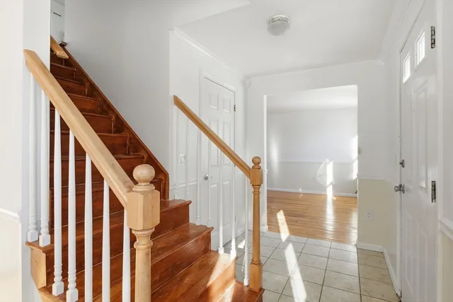 a view of a hallway with a wooden door