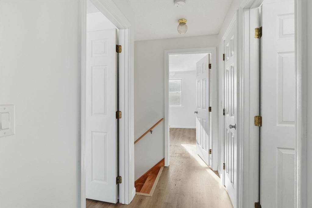 22 Pheasant Drive Springfield, MA 01119 - Photo 24 of 40 a view of a hallway with a wooden door