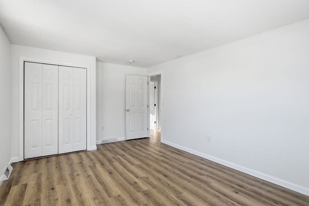 22 Pheasant Drive Springfield, MA 01119 - Photo 31 of 40 a view of an empty room with wooden floor