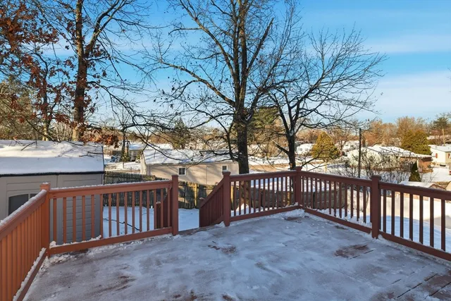 a view of a fence with large trees