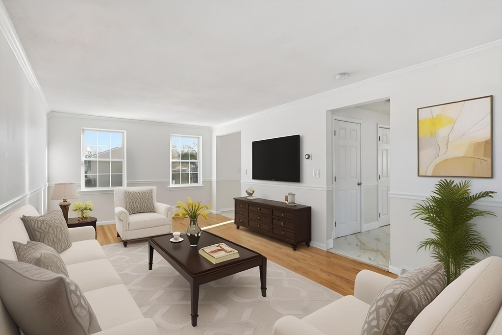22 Pheasant Drive Springfield, MA 01119 - Photo 9 of 40 a living room with furniture and a flat screen tv