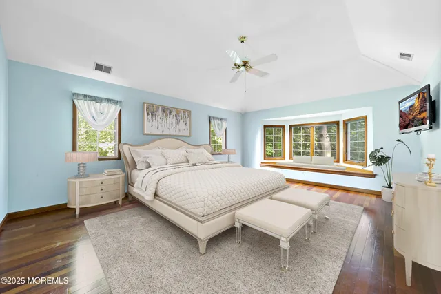 a room with pool table and windows