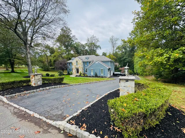 a view of a swimming pool and trees in the background
