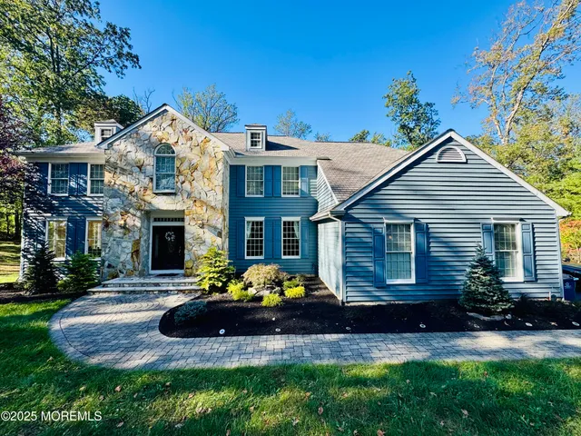 a view of an empty room with a fireplace and a large window