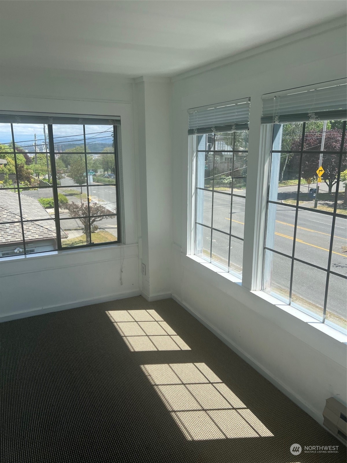 2515 Belvidere Avenue Southwest Seattle, WA 98126 - Photo 24 of 39 wooden floor in an empty room with a window