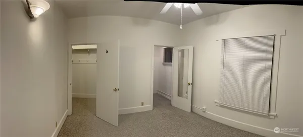 an empty room with a bathroom