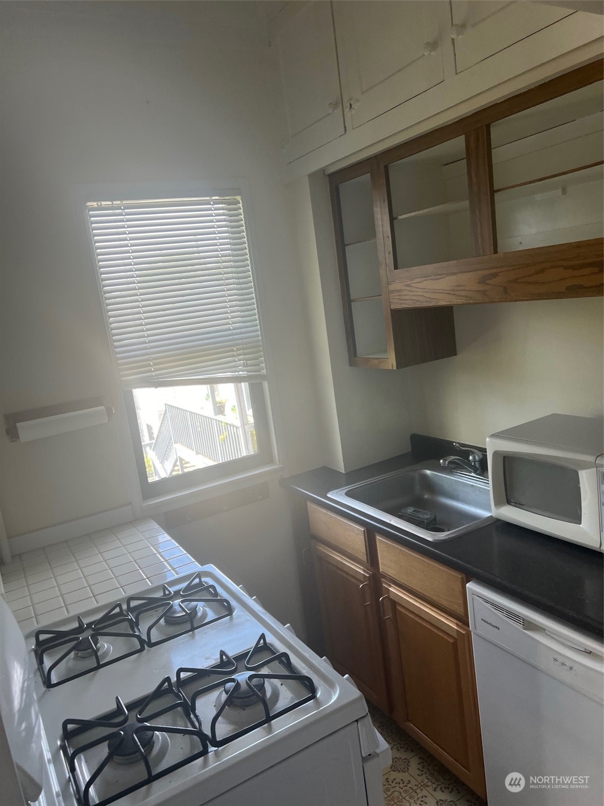 2515 Belvidere Avenue Southwest Seattle, WA 98126 - Photo 30 of 39 a kitchen with a stove and a sink