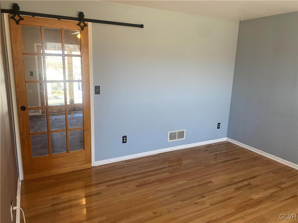 2910 Sickle Road Bath, PA 18014 - Photo 12 of 30 a view of an empty room with wooden floor and a window