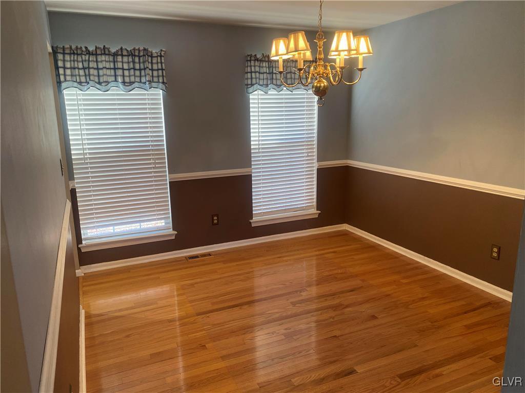 2910 Sickle Road Bath, PA 18014 - Photo 14 of 30 a view of empty room with wooden floor and chandelier