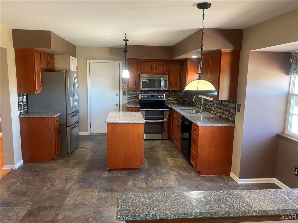 2910 Sickle Road Bath, PA 18014 - Photo 6 of 30 a kitchen with stainless steel appliances granite countertop a refrigerator a stove a sink and a microwave