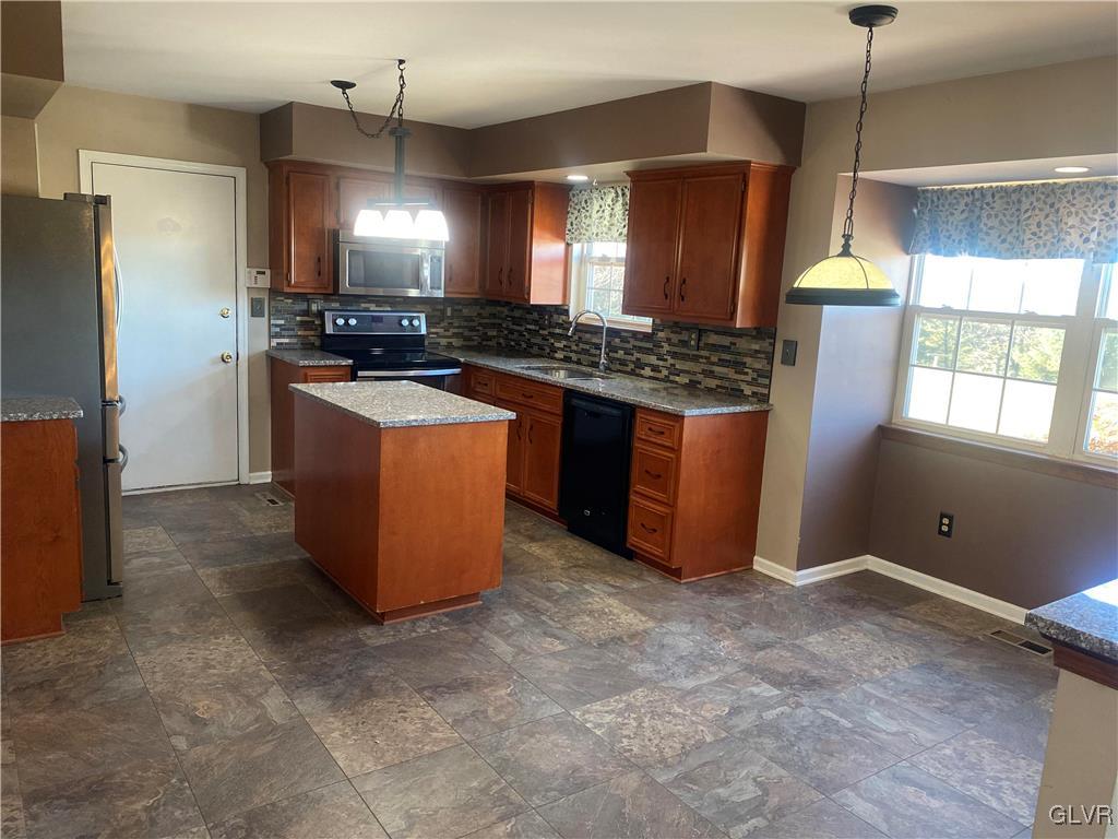2910 Sickle Road Bath, PA 18014 - Photo 7 of 30 a kitchen with stainless steel appliances granite countertop a stove a refrigerator a sink and a refrigerator