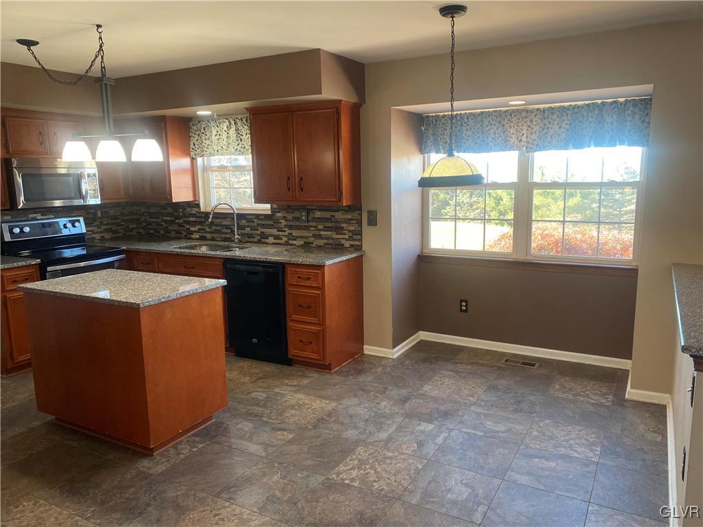 2910 Sickle Road Bath, PA 18014 - Photo 8 of 30 a kitchen with kitchen island granite countertop a stove and a sink