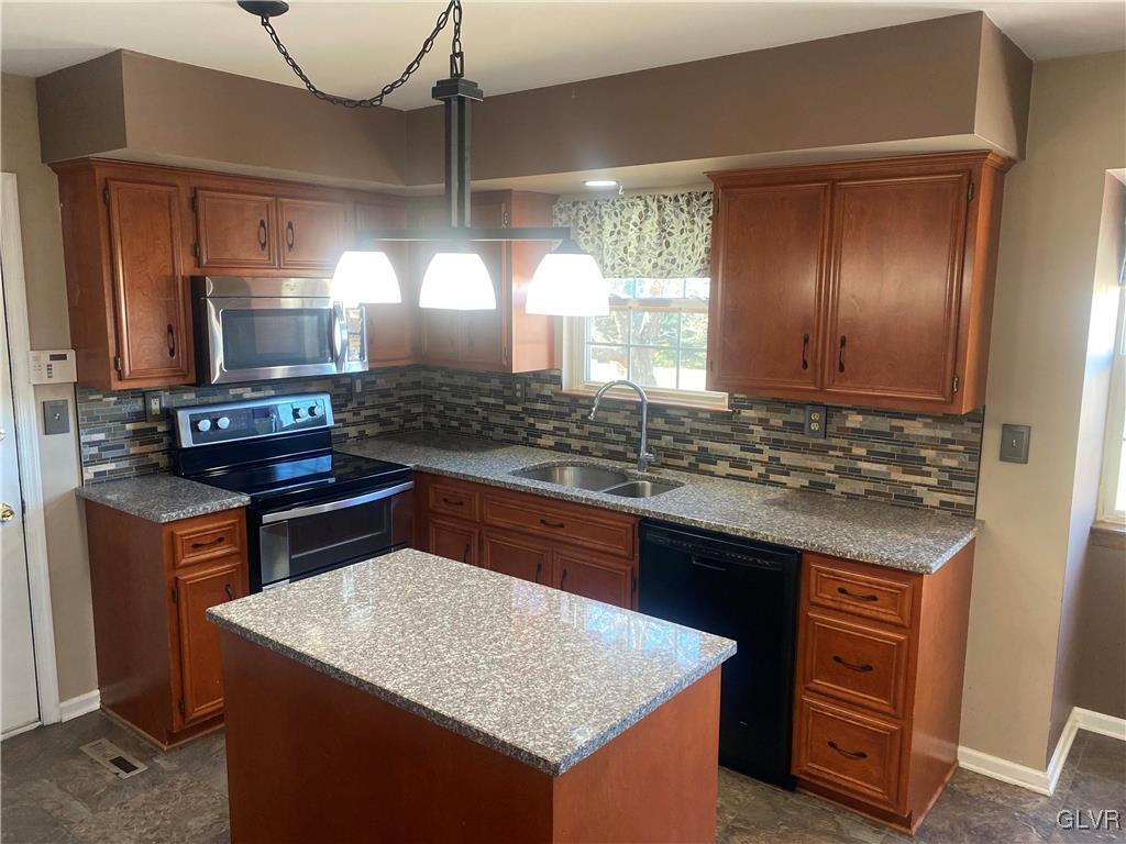 2910 Sickle Road Bath, PA 18014 - Photo 9 of 30 a kitchen with a stove and a wooden cabinets