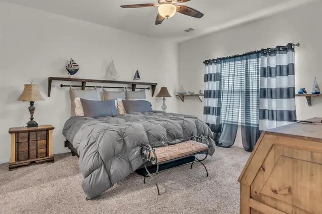 a bedroom with a bed and a couch