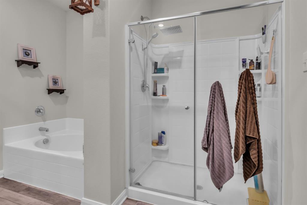 189 Point Rider Road Newark, TX 76071 - Photo 20 of 40 a bathroom with a bathtub and a shower