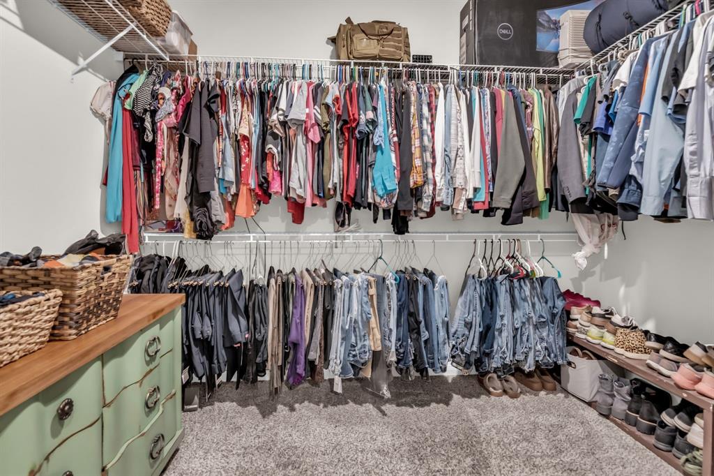 189 Point Rider Road Newark, TX 76071 - Photo 21 of 40 a view of walk in closet with clothes