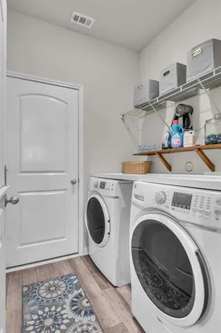 a utility room with dryer and washer