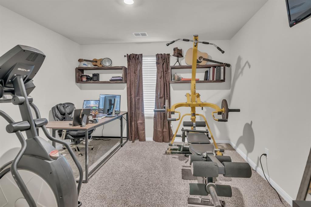 189 Point Rider Road Newark, TX 76071 - Photo 24 of 40 a view of a room with gym equipment