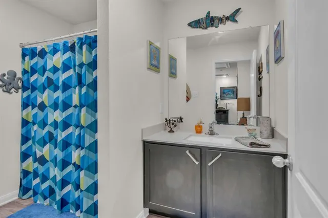 a room with a sink and a mirror