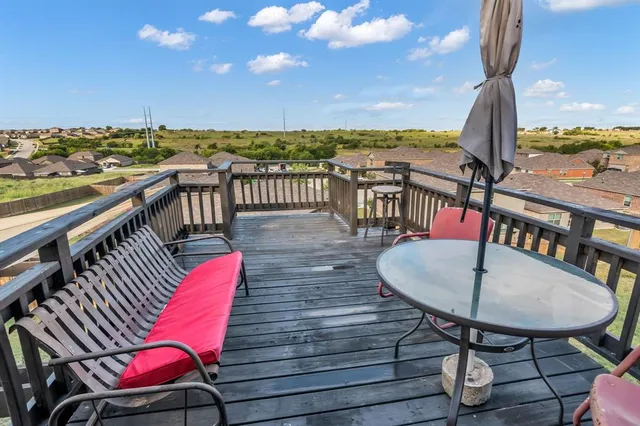 an outdoor sitting area with furniture