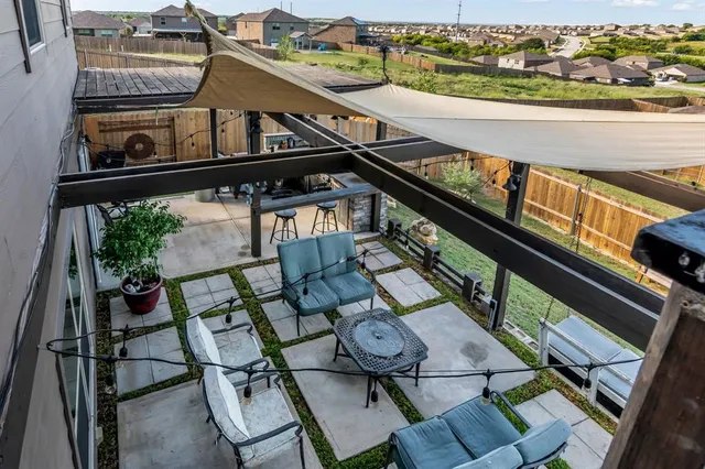 a view of balcony with furniture