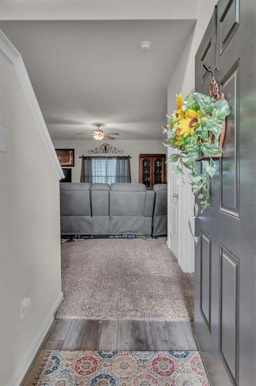 189 Point Rider Road Newark, TX 76071 - Photo 4 of 40 a living room with furniture flowerpot and a chandelier