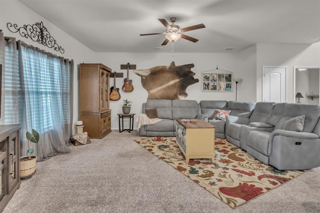 189 Point Rider Road Newark, TX 76071 - Photo 8 of 40 a living room with furniture and a rug