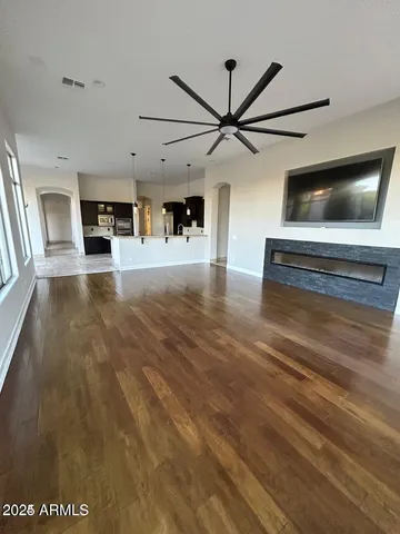 a view of living room with furniture and flat screen tv